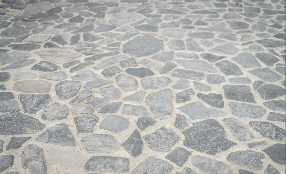 Flagstone patio installation in a Calgary backyard