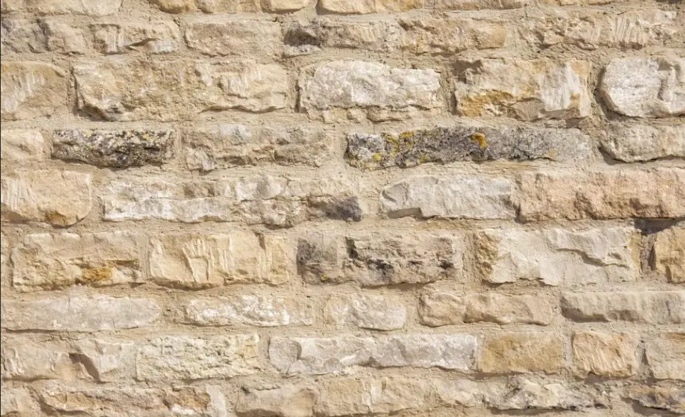 Modern limestone garden wall design in Calgary