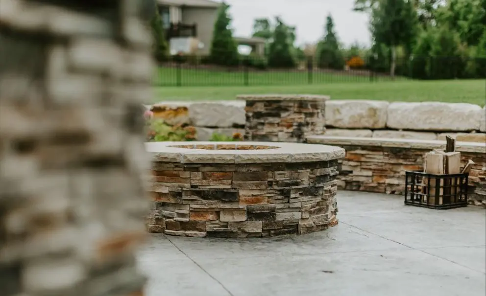 Manufactured stone veneer on an outdoor fireplace in Calgary