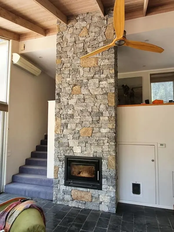 Modern Floor-to-Ceiling Stone Fireplace completed by Martini Stone Masonry in Calgary and surrounding Alberta communities.