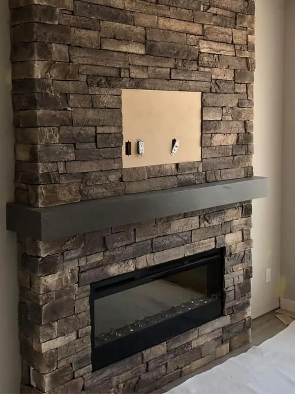 Natural Stone Fireplace Feature completed by Martini Stone Masonry in Calgary and surrounding Alberta communities.
