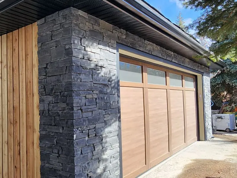 Natural stone veneer installed on a residential exterior in Calgary