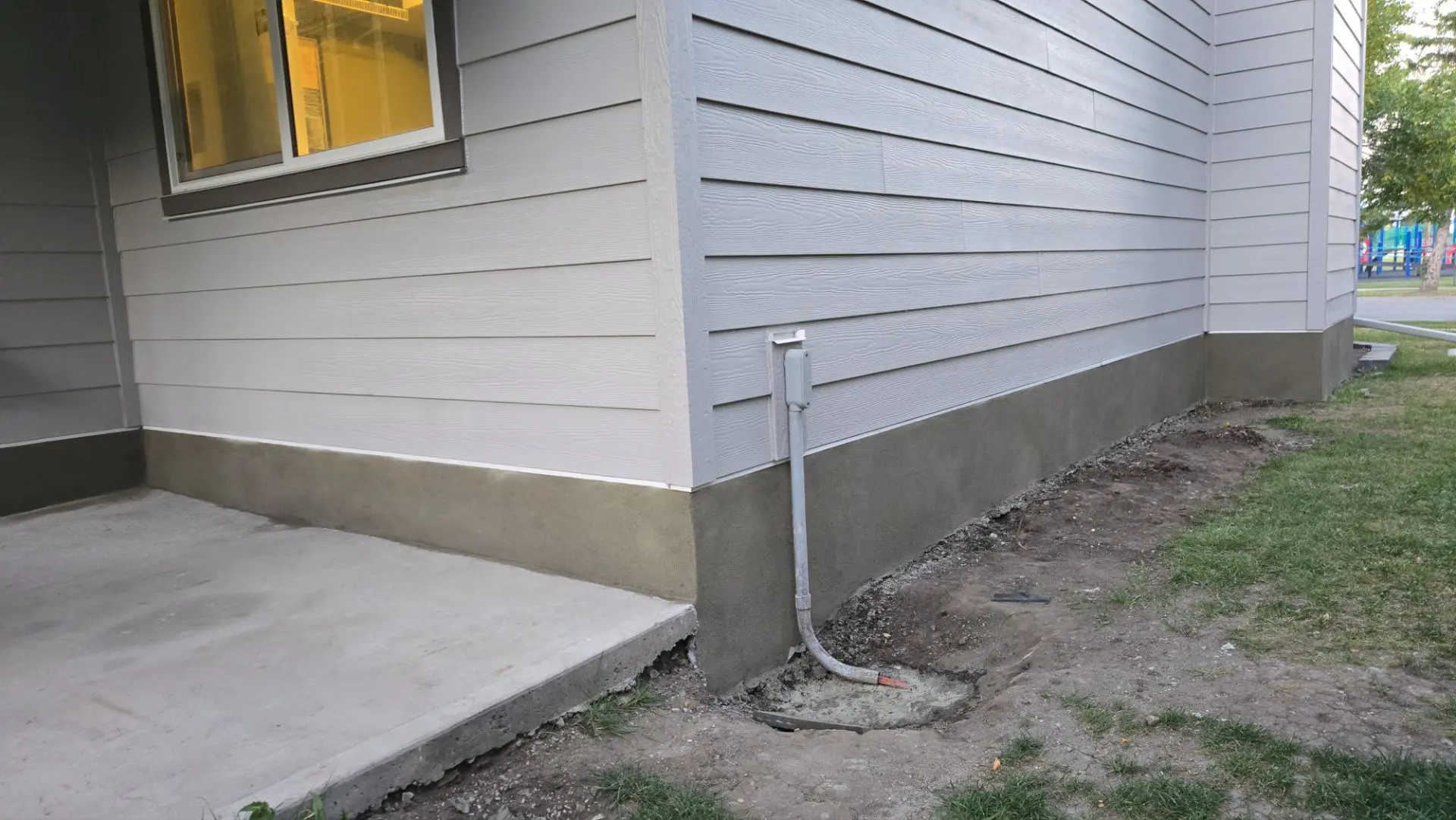 Parging applied to a foundation on Robinson Drive, Okotoks
