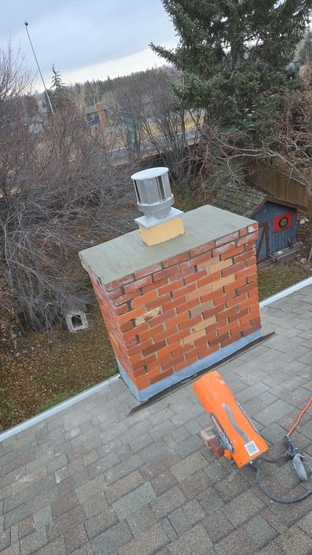 Brick chimney tuckpointing completed with controlled heating at Ranch Estates Drive NW in Calgary