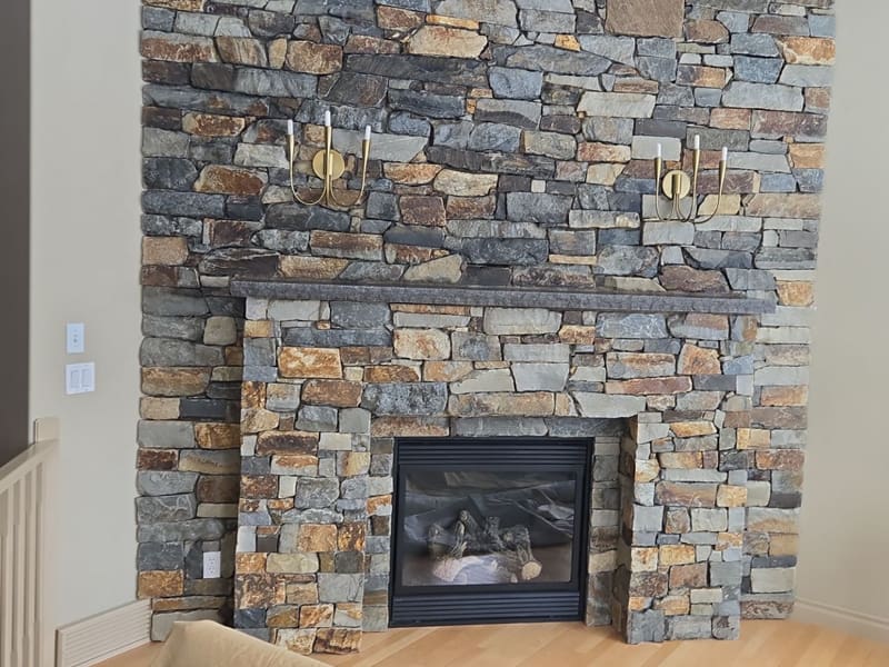 Interior natural stone feature wall with built-in fireplace